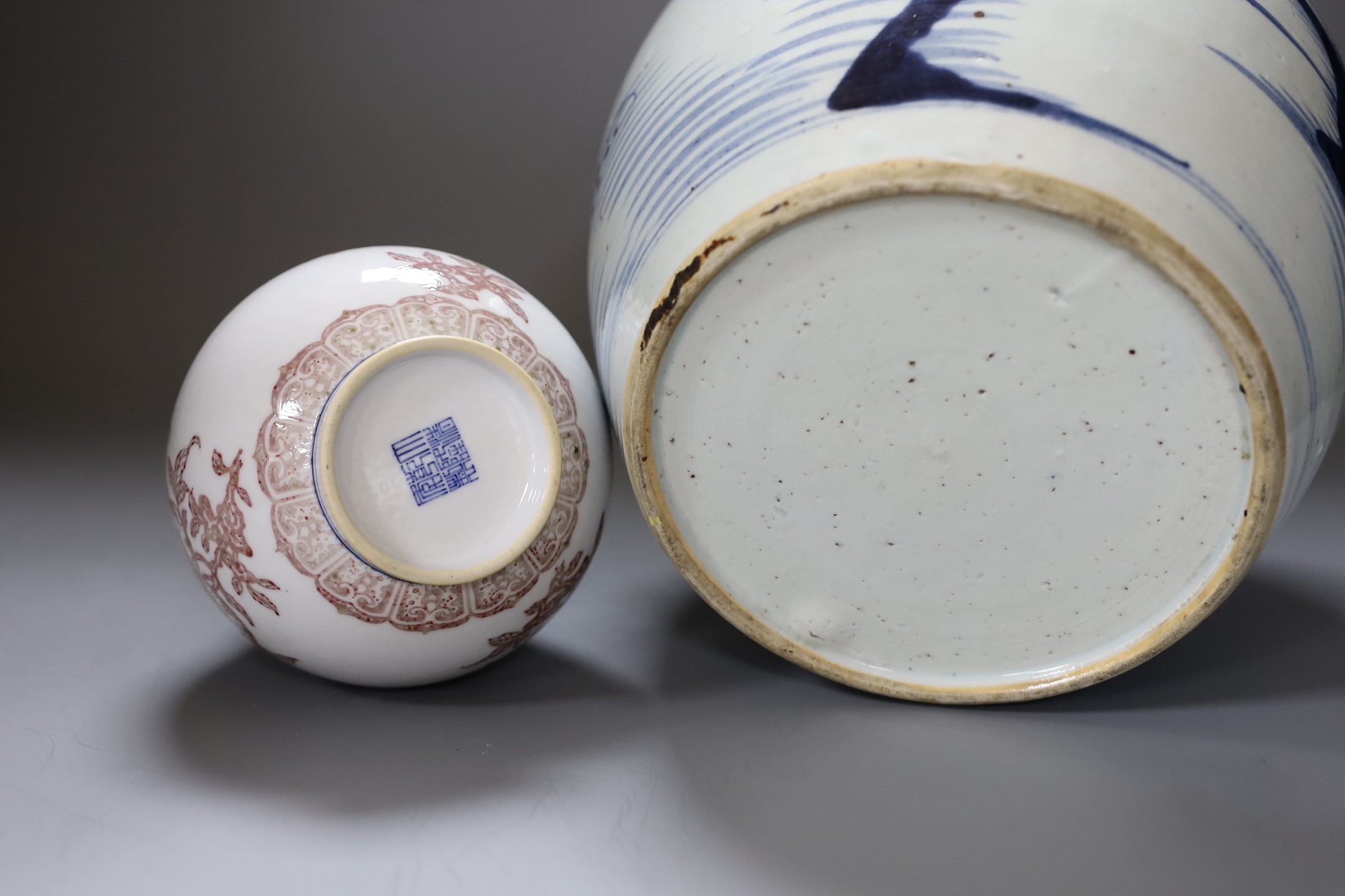 A Chinese Qing blue and white ginger jar with a painted landscape and a blue and copper-red pear shaped vase, tallest 22cm